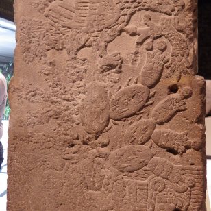 A stone altar with Opuntia carved into the rear.